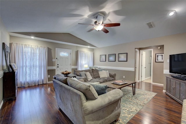 living room featuring ceiling fan, dark wood-type flooring, and lofted ceiling