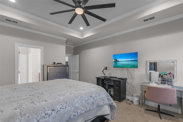 bedroom with a tray ceiling, crown molding, light colored carpet, and ceiling fan