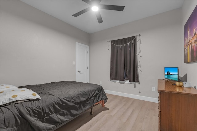 bedroom with ceiling fan and light wood-type flooring