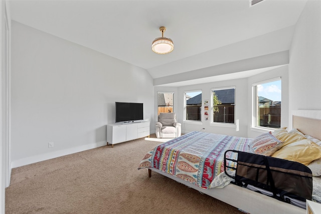 bedroom featuring carpet and vaulted ceiling