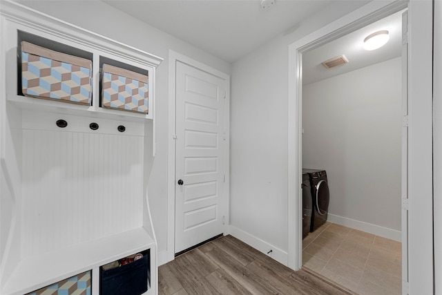 mudroom featuring washing machine and dryer