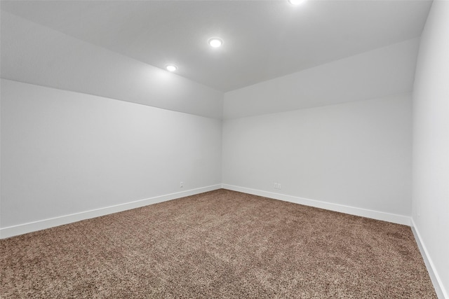 bonus room featuring lofted ceiling and carpet