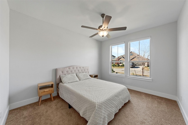 bedroom with ceiling fan and carpet