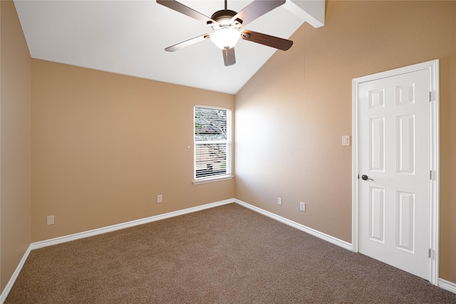 carpeted spare room featuring lofted ceiling and ceiling fan