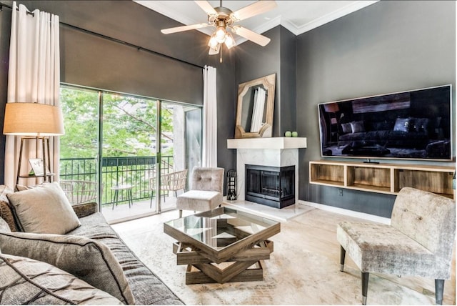 living room featuring ceiling fan, a multi sided fireplace, and crown molding