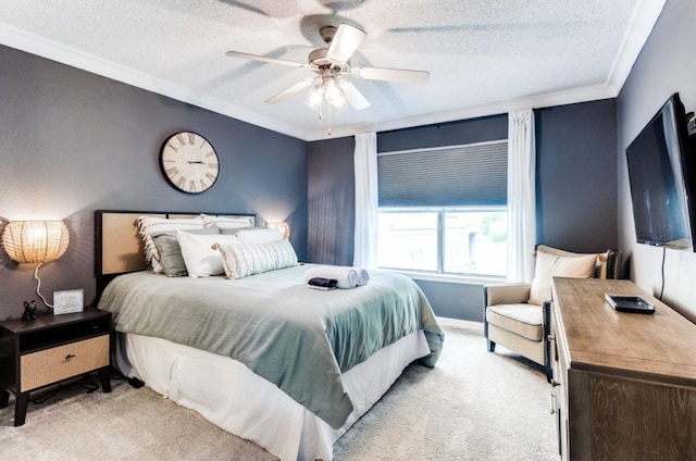 carpeted bedroom with ceiling fan, crown molding, and a textured ceiling