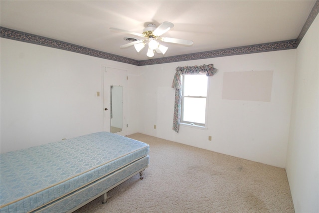 bedroom with ceiling fan and carpet