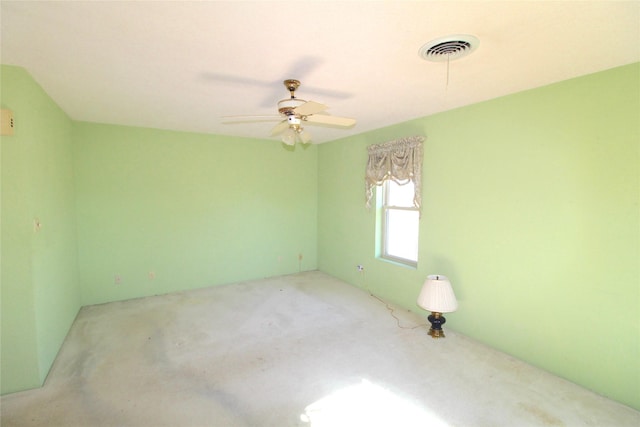 empty room featuring light colored carpet and ceiling fan