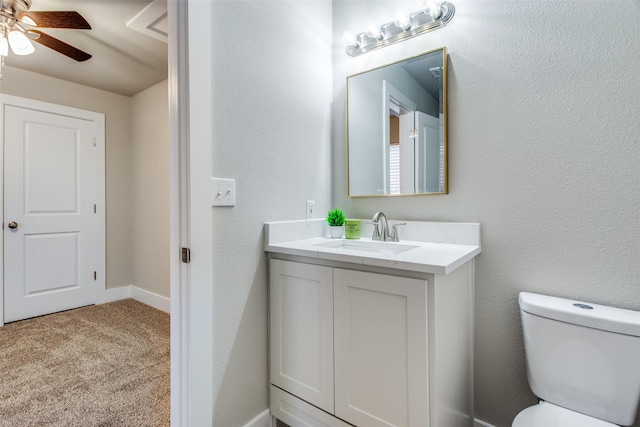 bathroom with vanity, ceiling fan, and toilet