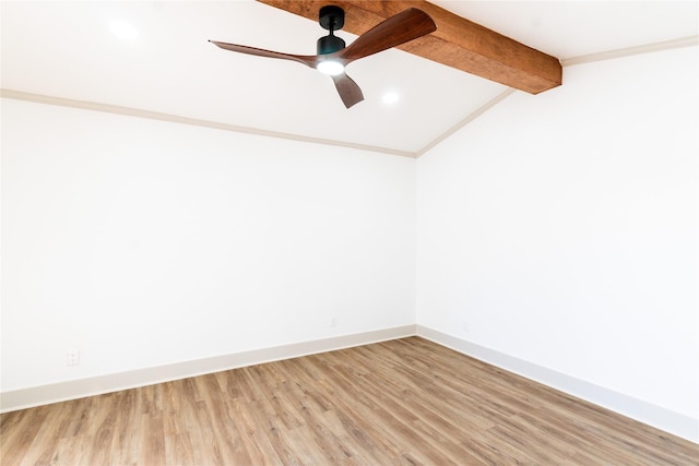 spare room with ceiling fan, hardwood / wood-style floors, and vaulted ceiling with beams