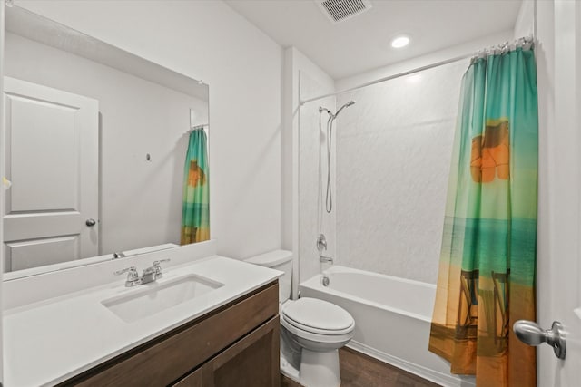 full bathroom featuring toilet, vanity, wood-type flooring, and shower / bath combo with shower curtain