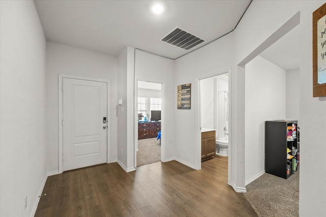 corridor with dark wood-type flooring