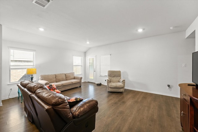 living room featuring dark hardwood / wood-style flooring and lofted ceiling