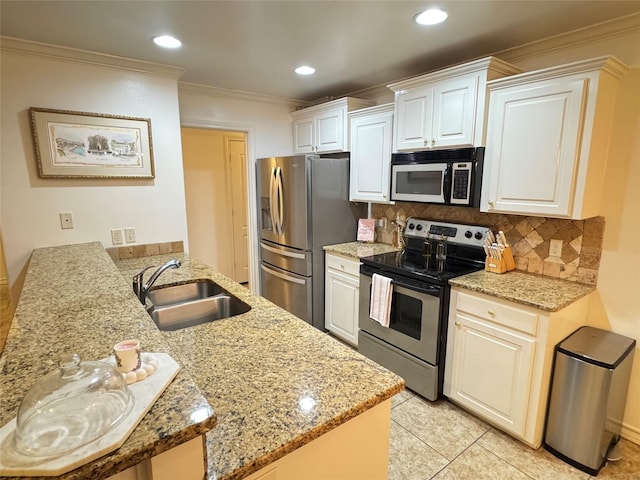 kitchen featuring kitchen peninsula, sink, light stone countertops, stainless steel appliances, and ornamental molding