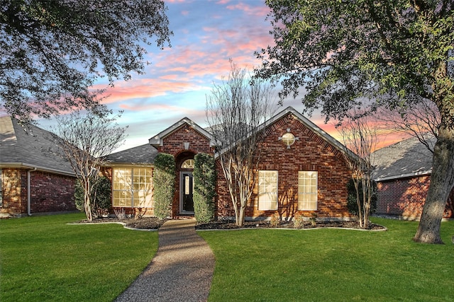 view of property featuring a lawn