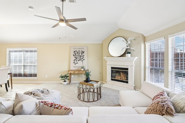 living room with ceiling fan, a wealth of natural light, crown molding, and lofted ceiling