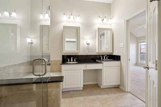 bathroom with ceiling fan, tile patterned flooring, and vanity