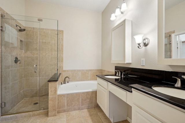 bathroom with tile patterned floors, separate shower and tub, and vanity