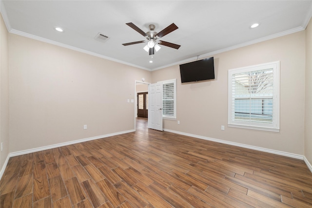 spare room with ceiling fan, wood-type flooring, and ornamental molding