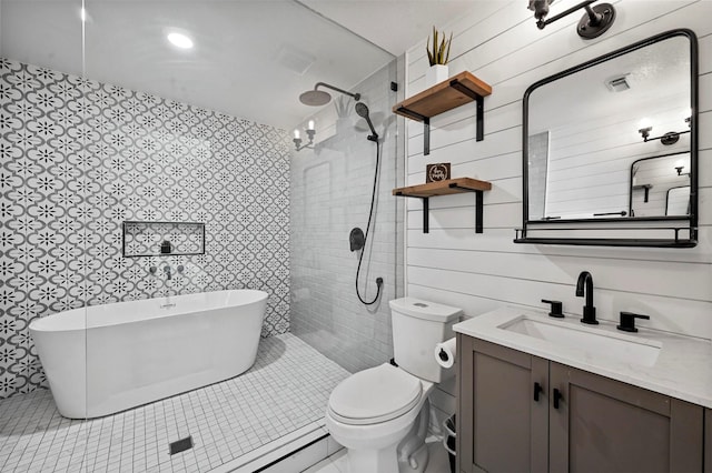 full bathroom featuring tile patterned floors, toilet, separate shower and tub, and vanity