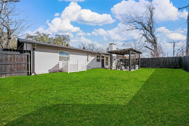 back of house with a pergola and a lawn