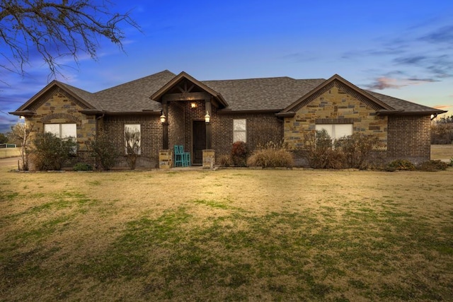 view of front of house with a yard