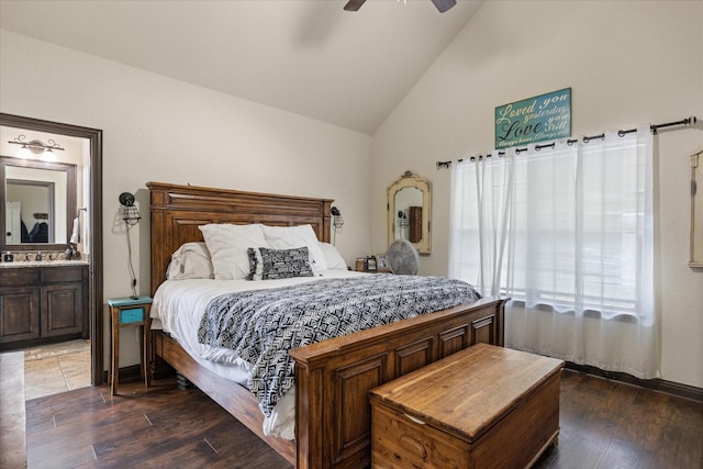 bedroom featuring ensuite bathroom, ceiling fan, dark hardwood / wood-style flooring, and lofted ceiling