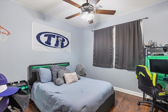 bedroom featuring ceiling fan and dark hardwood / wood-style floors