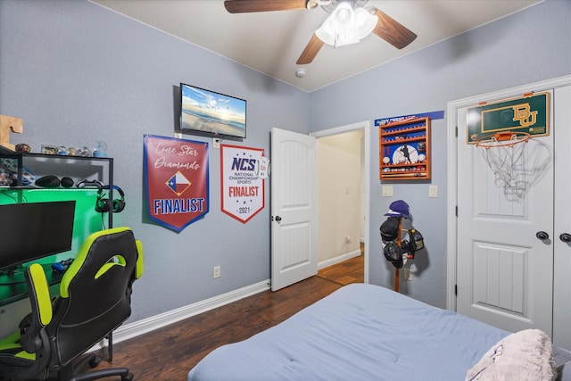 bedroom featuring ceiling fan and dark hardwood / wood-style floors