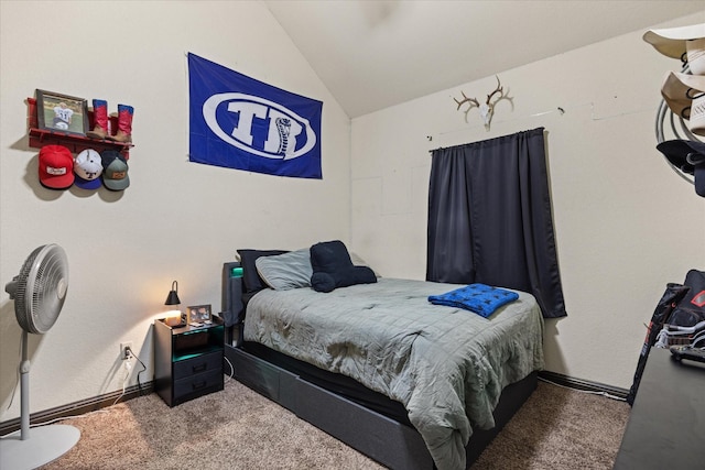 carpeted bedroom with lofted ceiling