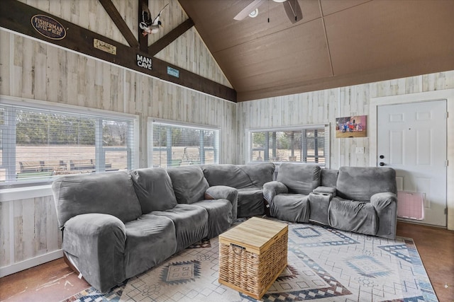 living room featuring ceiling fan, a wealth of natural light, and high vaulted ceiling