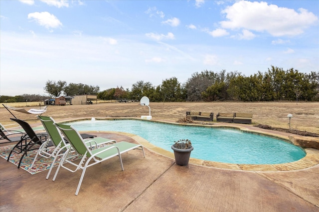 view of pool with a patio