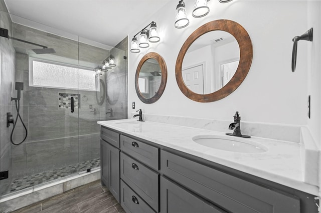 bathroom with vanity and an enclosed shower