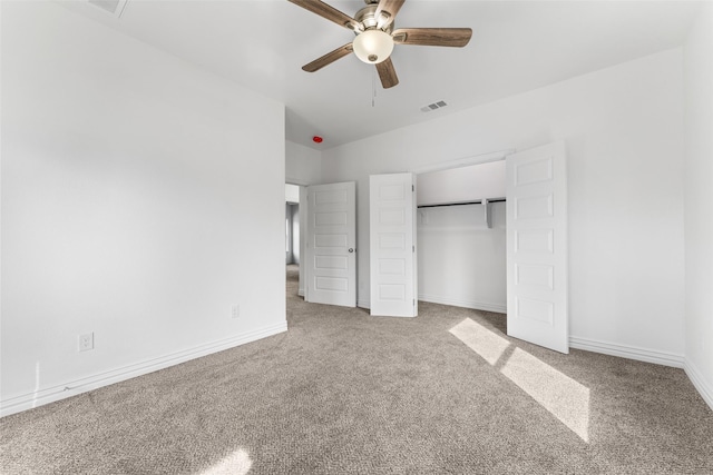 unfurnished bedroom with carpet, ceiling fan, and a closet