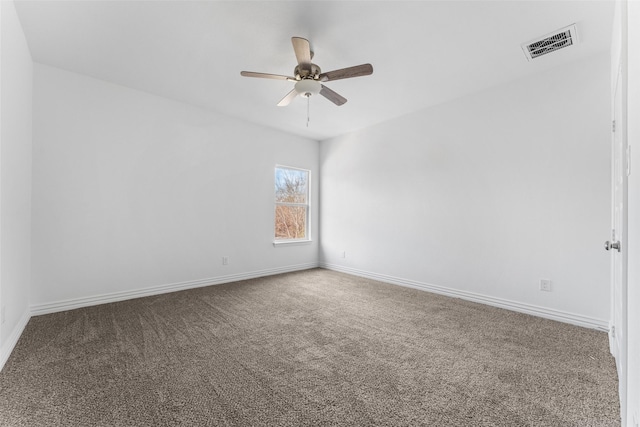 empty room with carpet and ceiling fan