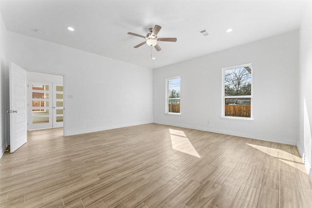 empty room with light hardwood / wood-style flooring and ceiling fan