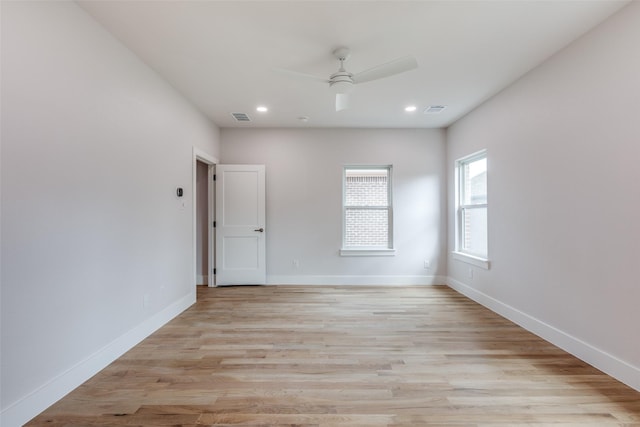 empty room featuring ceiling fan and light hardwood / wood-style flooring