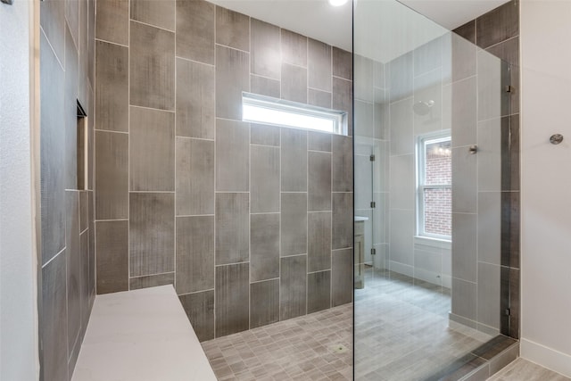 bathroom featuring tiled shower