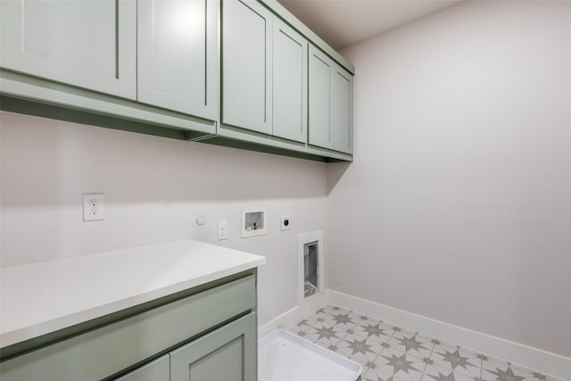 laundry area with gas dryer hookup, washer hookup, electric dryer hookup, and cabinets