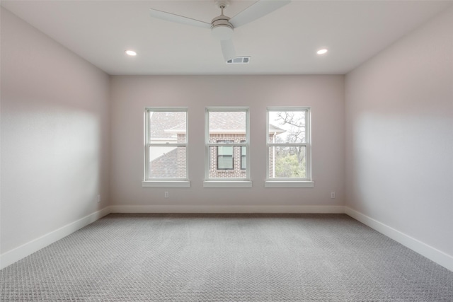 carpeted empty room with ceiling fan