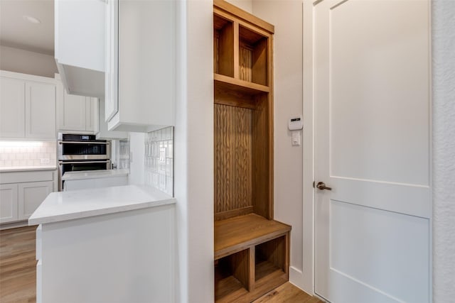 mudroom with light wood-type flooring