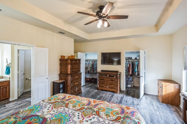 bedroom with dark hardwood / wood-style flooring