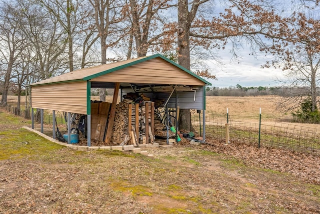 view of outbuilding featuring a rural view