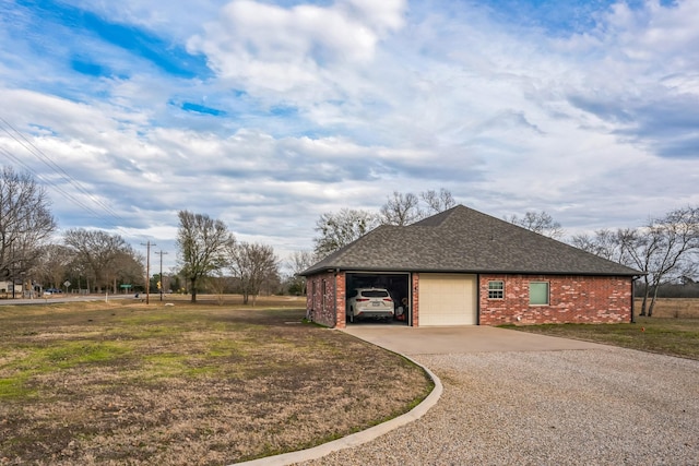 view of home's exterior with a lawn and a garage