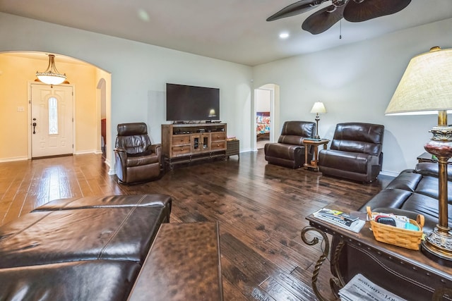 living room with ceiling fan and wood-type flooring