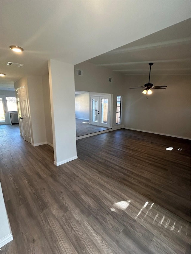 unfurnished living room featuring ceiling fan, dark wood-type flooring, lofted ceiling, and french doors