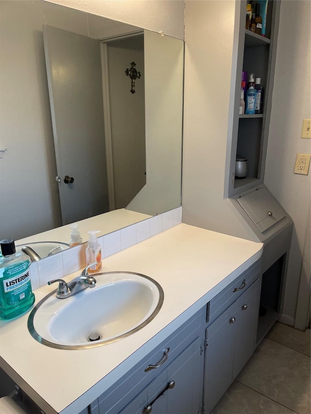 bathroom with tile patterned floors and vanity