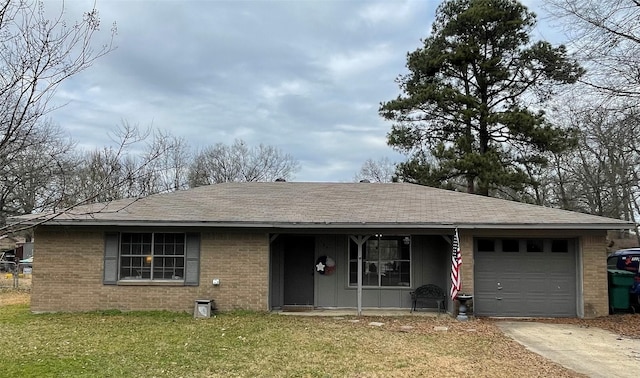 single story home featuring a front lawn and a garage