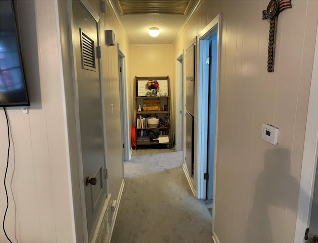 hall featuring light carpet and ornamental molding