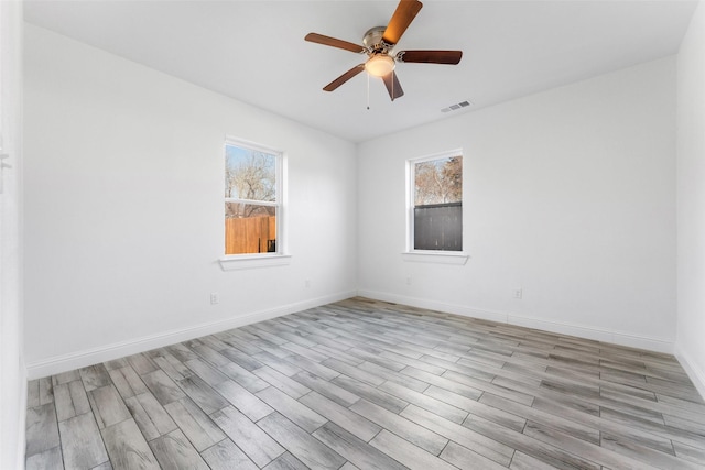 unfurnished room with ceiling fan and light hardwood / wood-style floors